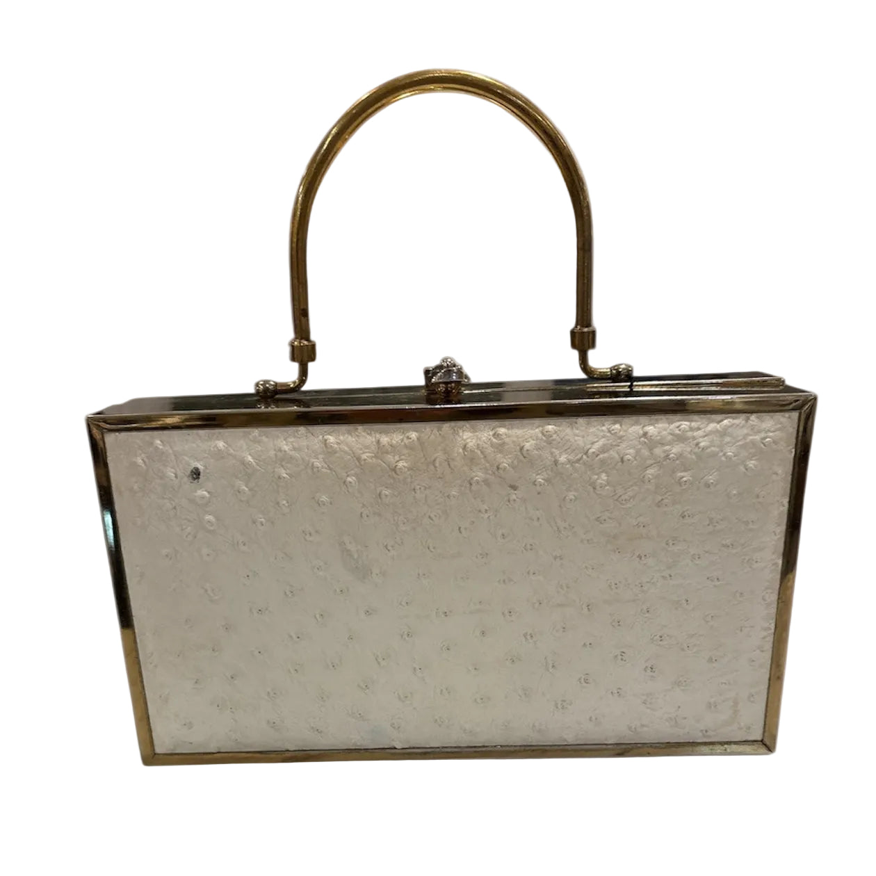 Vintage cream ostrich leather & brass handbag with a brass handle on a white background