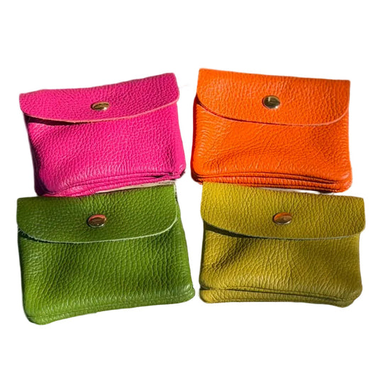 Four colorful leather pouches (pink, orange, green, yellow) on a white background