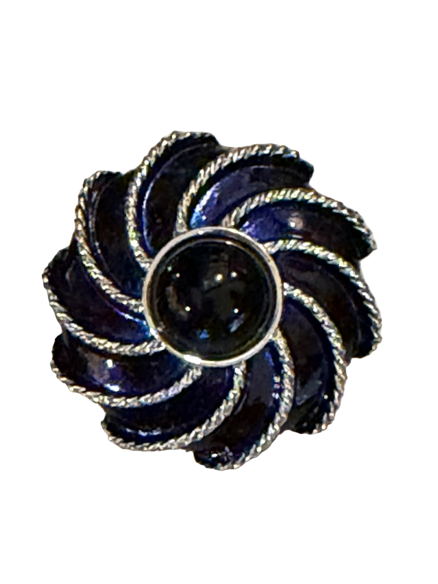 Decorative vintage brooch with blue and silver design on a white background