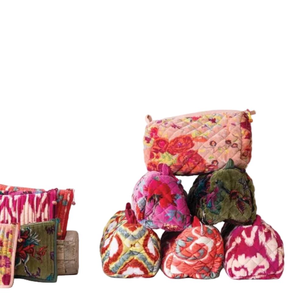Stack of colorful fabric bags on a white background